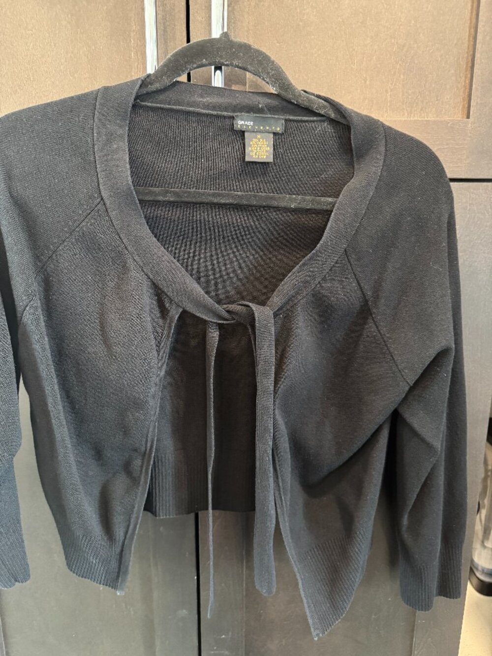 3/4 sleeve black shrug.  Light weight, great layering piece!